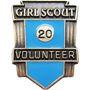Blue Pin Enscribed with 'Girl Scout Volunteer' and '20' Text