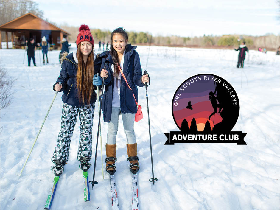 Two Girl Scouts cross-country skiing