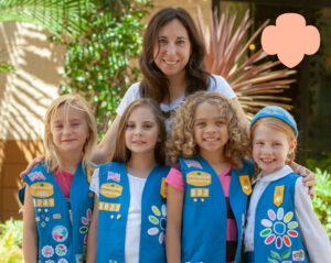 Troop leader with four Daisy Girl Scouts